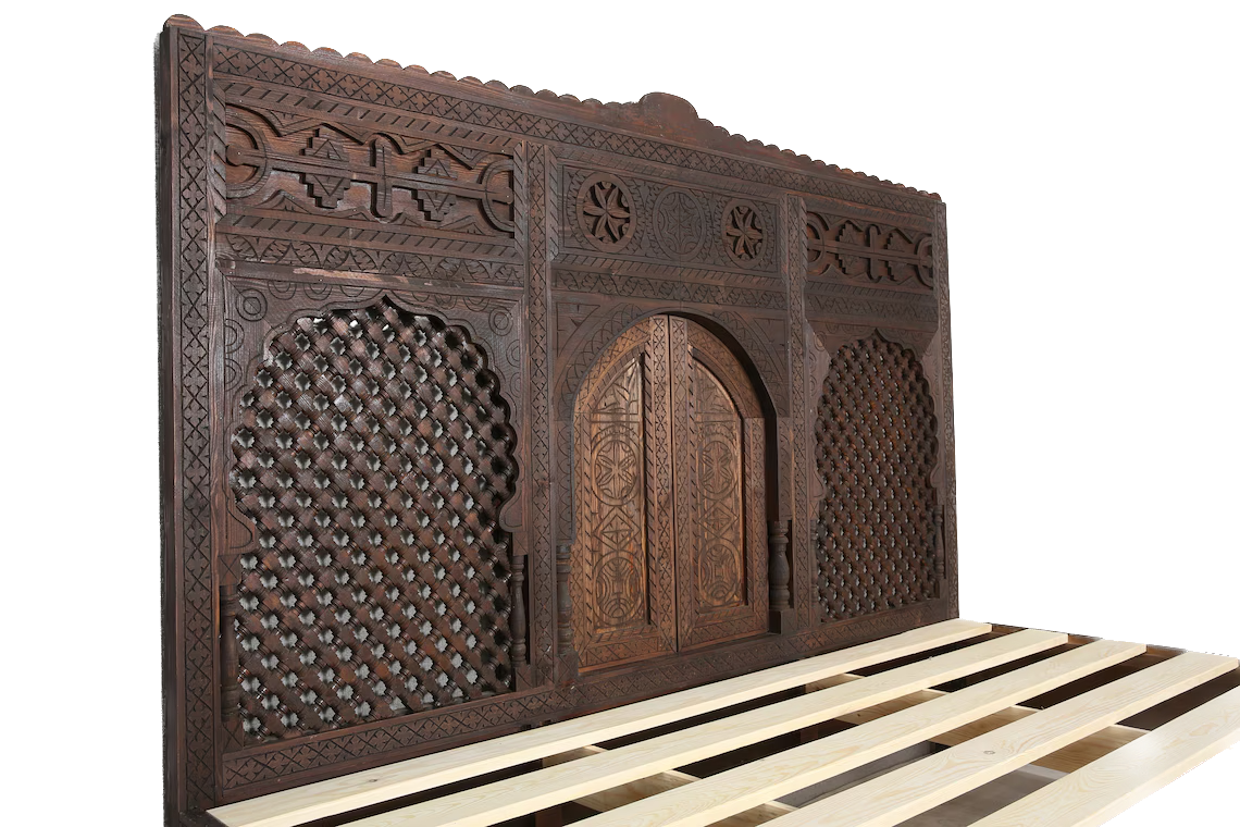 A handcrafted wooden bed that adds a touch of exotic elegance to any bedroom.
