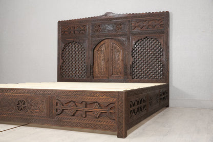 The wooden slats of a Moroccan-inspired bed frame.