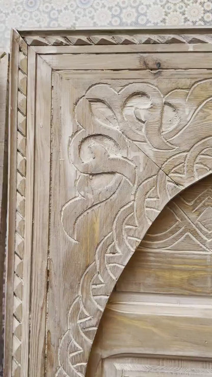 The tranquility and enchantment of Morocco enters your home through this exquisitely carved white door.